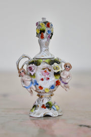 Floral Encrusted Porcelain Small Urn with Putti